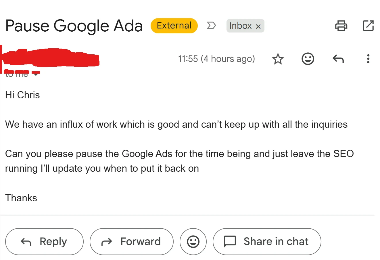 A real client email asking us to pause their Google Ads because the influx of work had outrun what the team could handle. The sender details are redacted.